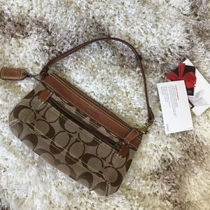 Authentic coach wristlet. Canvas with leather